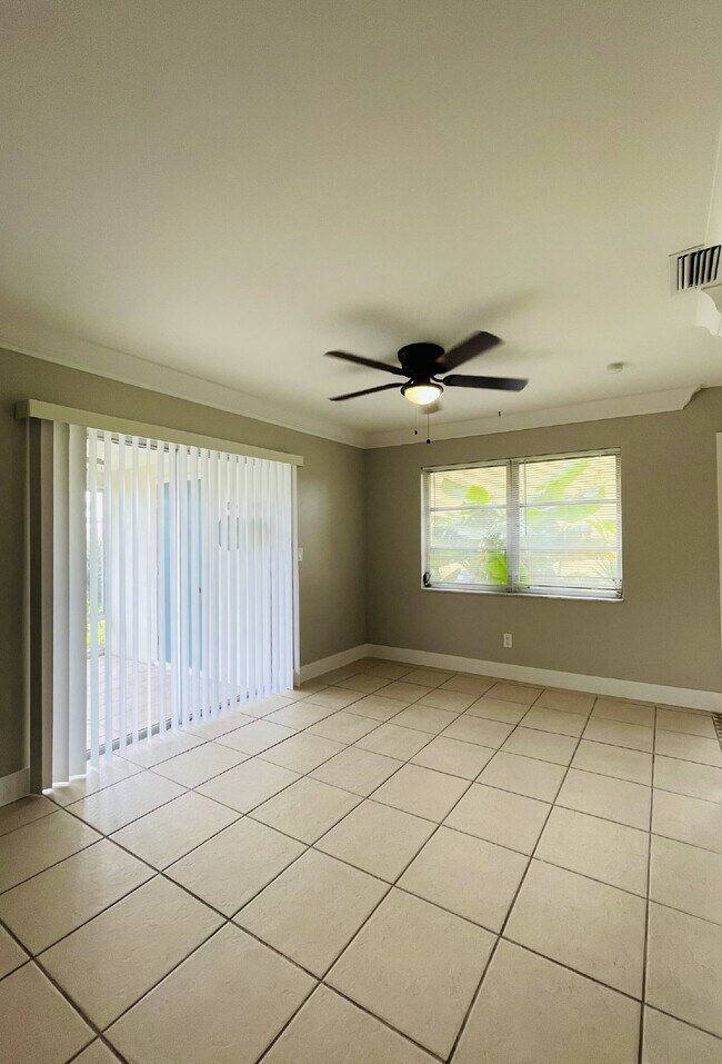 Building Photo - Updated 2-bedroom waterfront duplex with walk-in closets, enclosed Florida room, and canal views ...