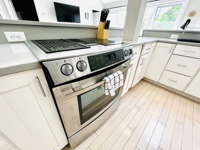 Kitchen with stainless steel appliances - 165 Stockbridge Rd