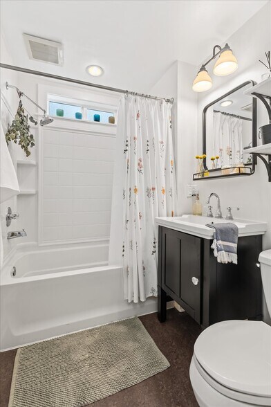 Bathroom with storage vanity and shelving - 8042 Earl Ave NW