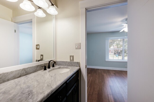 Building Photo - Modern Elegance: 3-Bedroom Townhome with Wood Flooring, Shaded Deck, and Inclusive Amenities