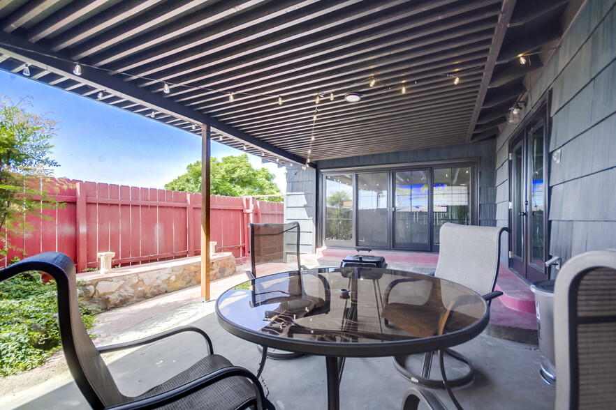 This spacious outdoor lounge is perfect for sunny get-togethers or evening BBQs - 5551 Churchward St