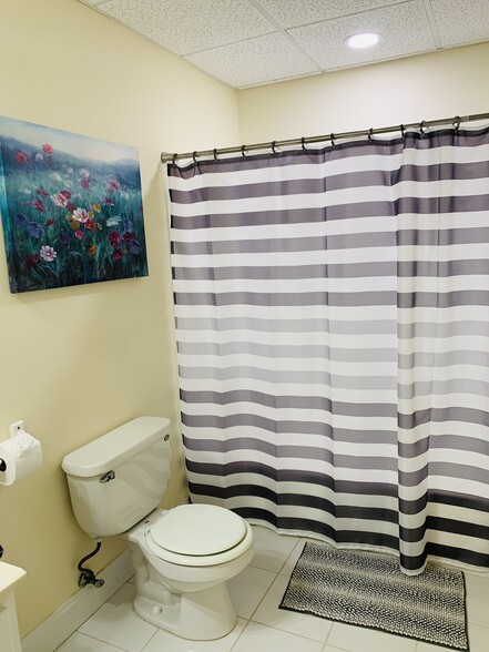 Modern, clean, and functional bathroom featuring updated fixtures, ample storage, and bright - 2337 Ashmel Ct SW