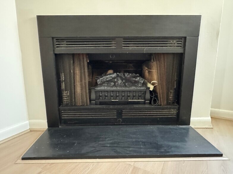 Fireplace with Duraflame Electric Log Insert - 95 Driftwood Ct