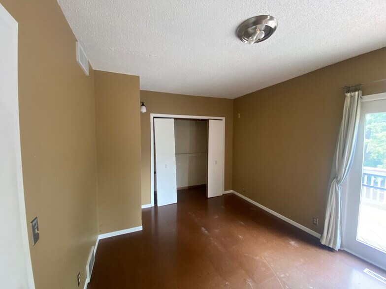 Bedroom 1 (or office) on main level; deck off back - 2313 22nd Ave S