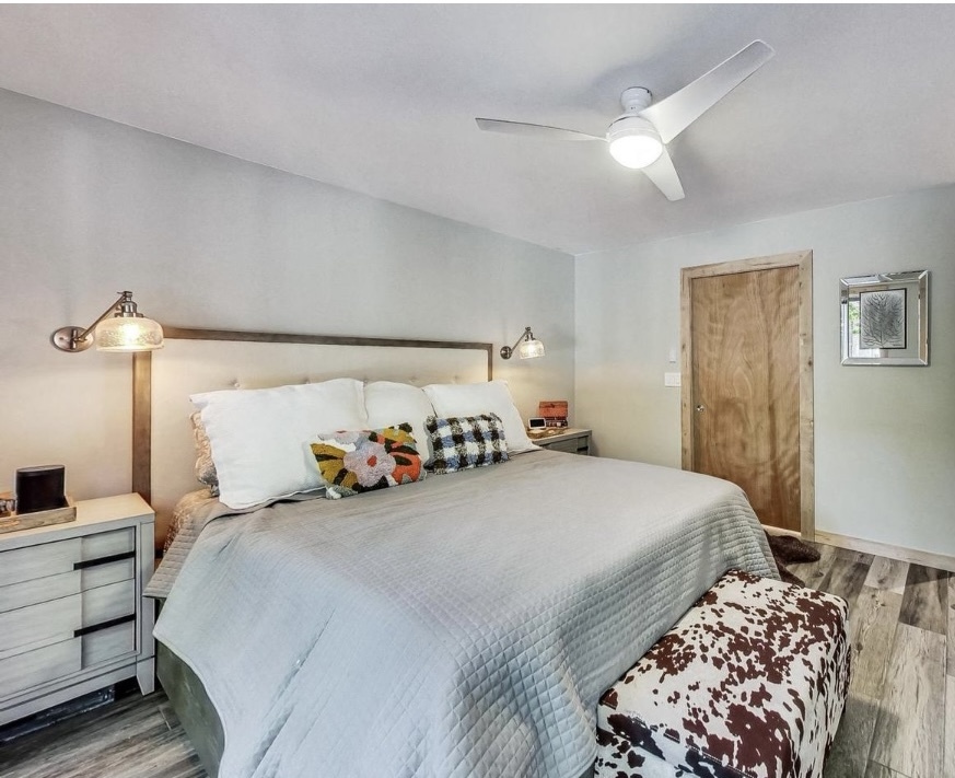 Primary bedroom with fan, sconces, tv, soundbar, blinds - 150 W Eugenie St