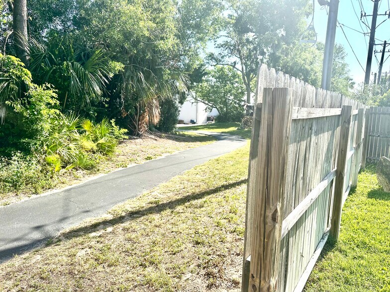Back trail leads to Publix shopping center, walking distance away - 108 Pinion Cir