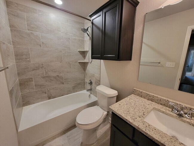 Building Photo - Bryan - 3 bedroom / 2 bath / 2 car garage house with fenced in back yard.