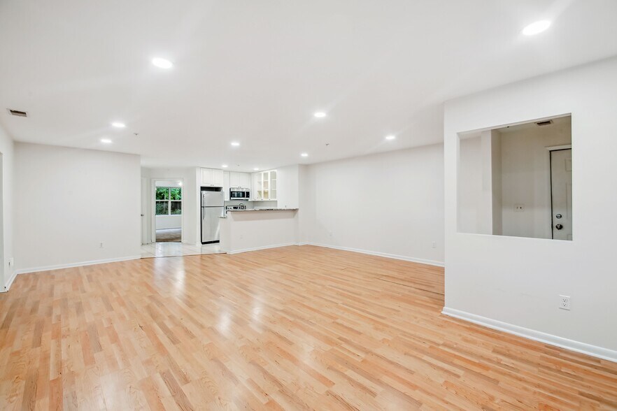 Living Room Looking Into Kitchen and Second Bedroom - 30 Hearthstone Ct