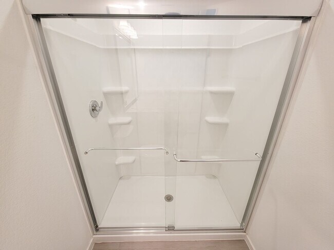 Building Photo - This single-level home showcases a spacious open floorplan shared between the kitchen, dining are...