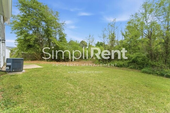 Building Photo - Updated Home with Spacious Layout & Private Backyard