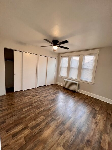 bedroom with spacious closet and plenty of natural light - 340 E Broadway Ave