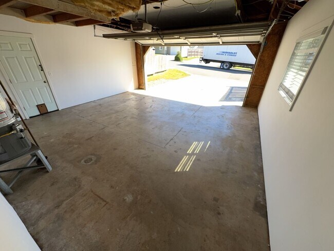 Building Photo - Newley updated 3-bedroom home features fenced yard, garage, and covered patios!