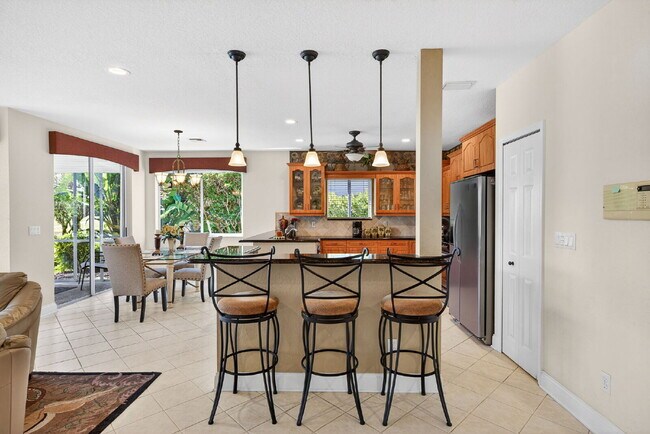 Building Photo - This 2 bedroom plus den, 2 bath condo with a one car garage offers expansive golf course and lake...