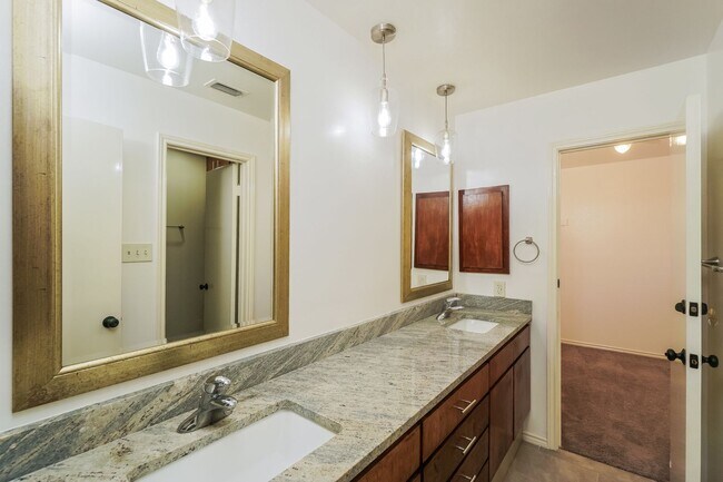 Building Photo - Charming 2-Bedroom Condo in Gated Community Surrounded by Mature Trees