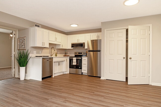 Kitchen with quartz counters, stainless appliances, and modern cabinetry - Vetra Providence