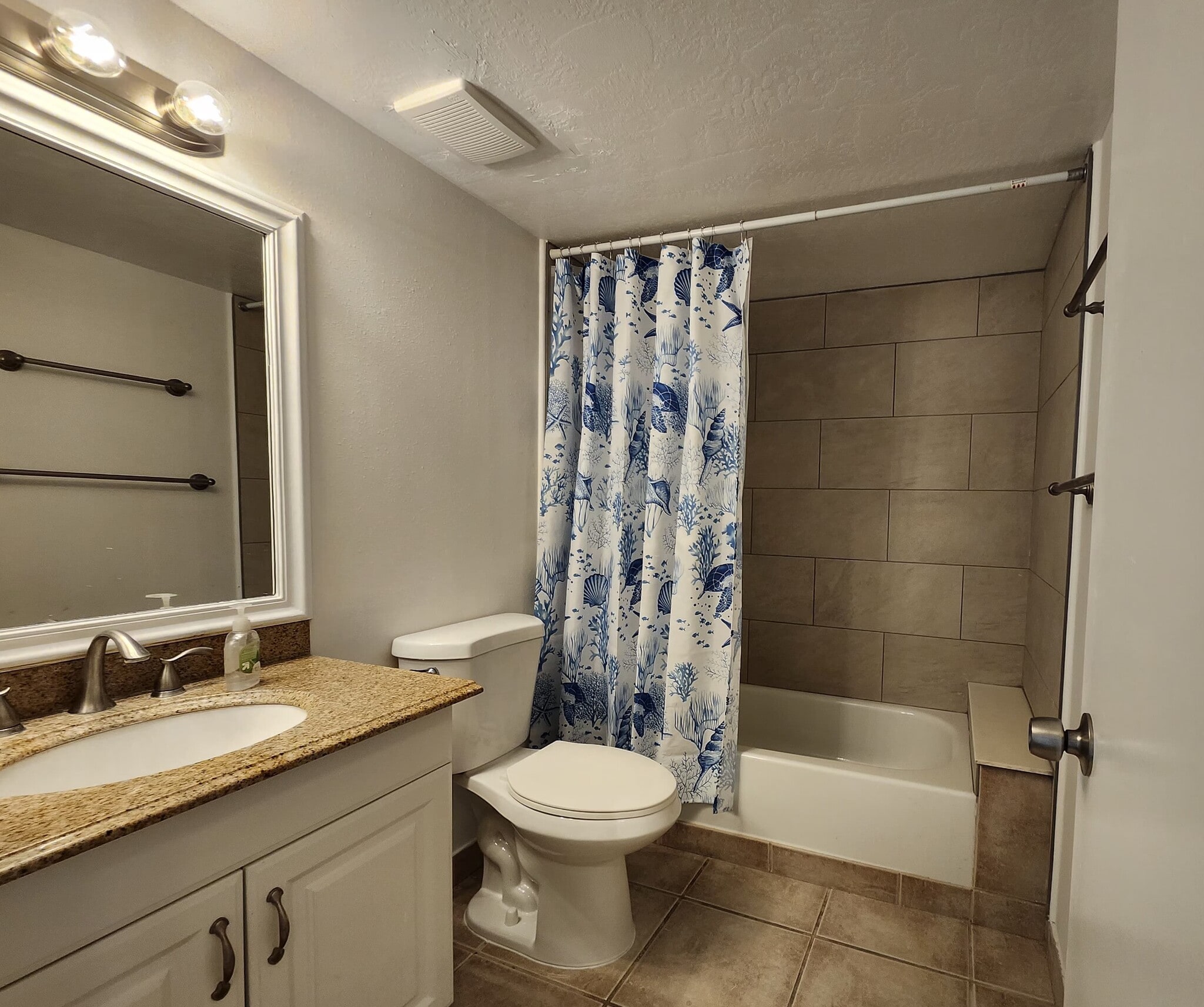 2nd bathroom remodeled in 2026 with ceramic tile walls... - 1353 Pine Ridge Cir E