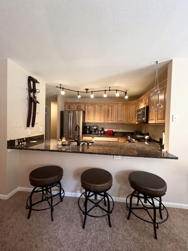 Building Photo - Two-Bedroom Condo with Attached Garage, Available Now