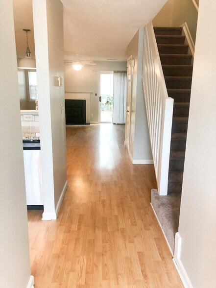 entry to home, gas fireplace, slider to patio - 2210 Cigar Ct