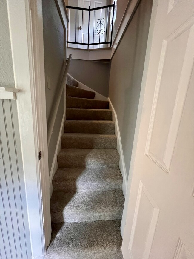 Stairs off of Kitchen to upstairs - 7032 Camden Ct