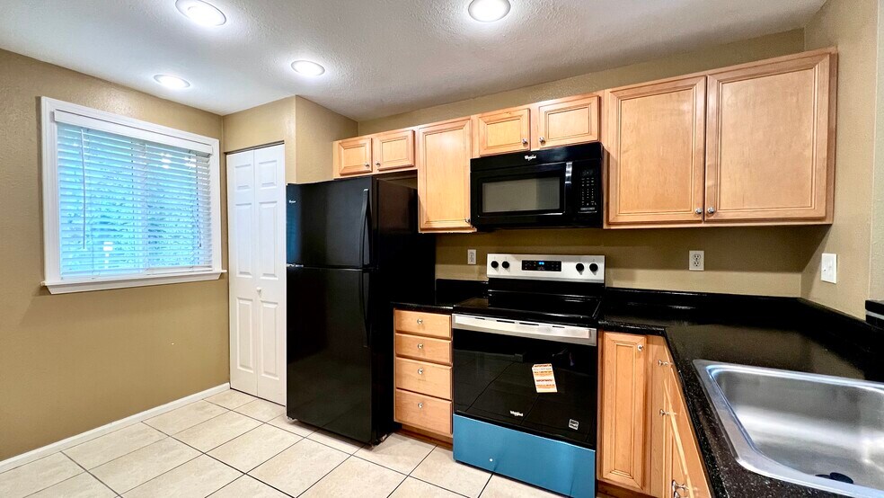 Left hand side of Foyer is Kitchen - 712 126th Ave NE