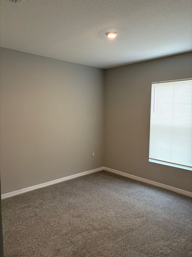 Building Photo - Beautiful 4-Bedroom Corner-Lot Home in Poinciana with 2-Car Garage