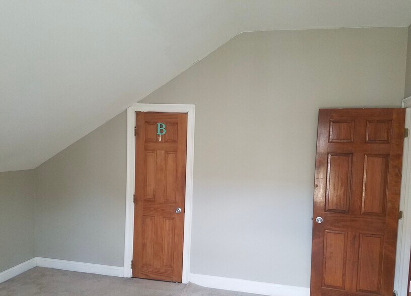 Bedroom 4 measures 12’8” by 13’8” and has a ceiling fan. - 9 Jay St