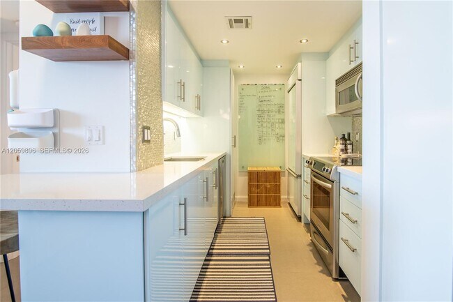 Building Photo - 10275 Collins Ave