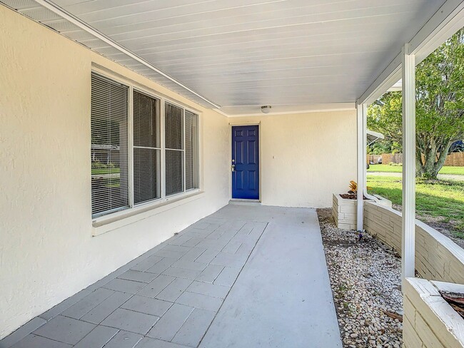 Building Photo - 2/2/1 with  RENOVATED baths & kitchen, fenced yard, NEW lvp flooring and a OVERSIZED lanai!