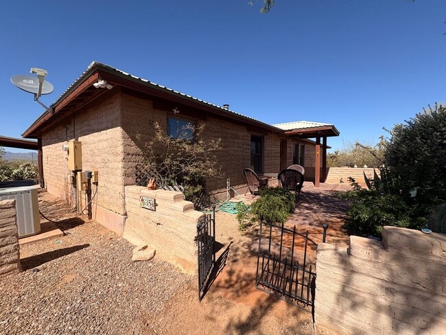 Building Photo - Desert Home on 3.3 Acres with Rooftop Views & Unique Rammed Earth Design