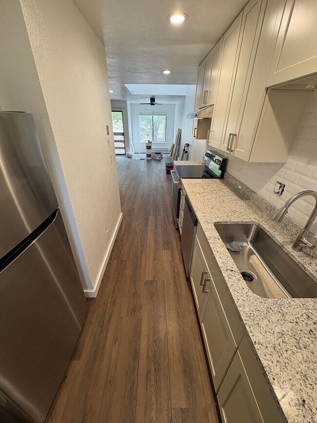 Building Photo - Completely Renovated 2 Bed 1.5 Bath West Pearl Street Condo W/Hiking Trails In Your Backyard.