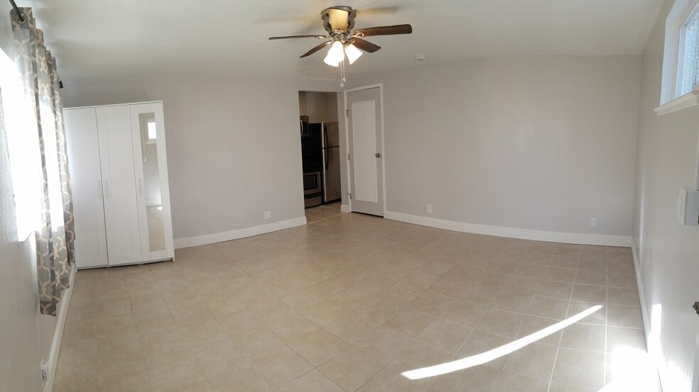 Main living, entryway into kit & laundry - 830 Spruce Ct