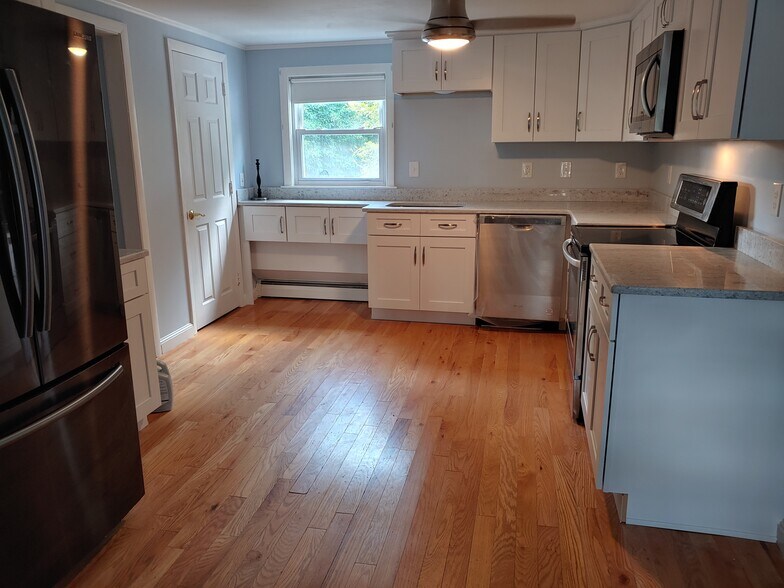 new appliances in kitchen laundry to left in closet, two windows front and back - 623 Old West Central St