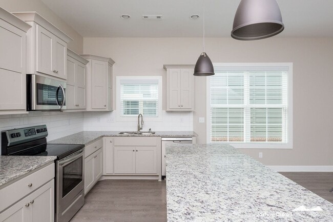 Building Photo - Now Pre-Leasing — Brand-New Luxury Townhom...