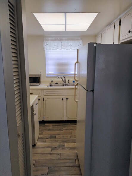 Kitchen off living rm fridge pulled away from wall - 2831 Swifton Dr