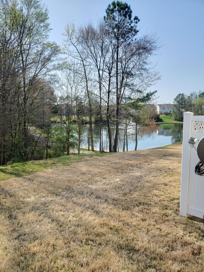 outdoor area bordering scenic pond - 2527 Early Flight Dr
