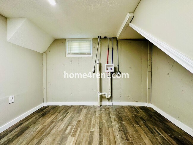 Building Photo - Like New, Ranch Style Home in Raytown - Wood Floors, Finished Basement, Fenced Yard!