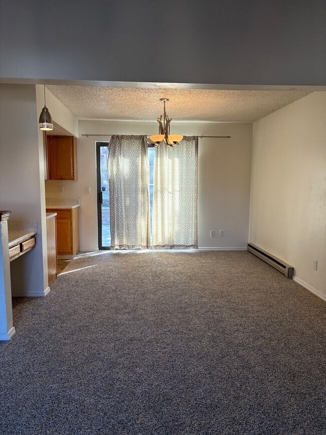 Building Photo - 1 Bedroom 1 Bath Townhome with Garage Parking in Village Seven