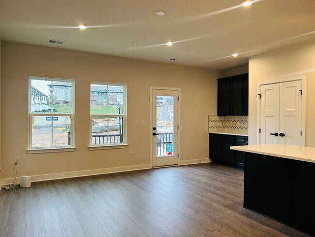 Building Photo - New Construction • 4 BR • 2 Full / 2 Half BA • End Unit Townhome in Village Town – Fayetteville’s...