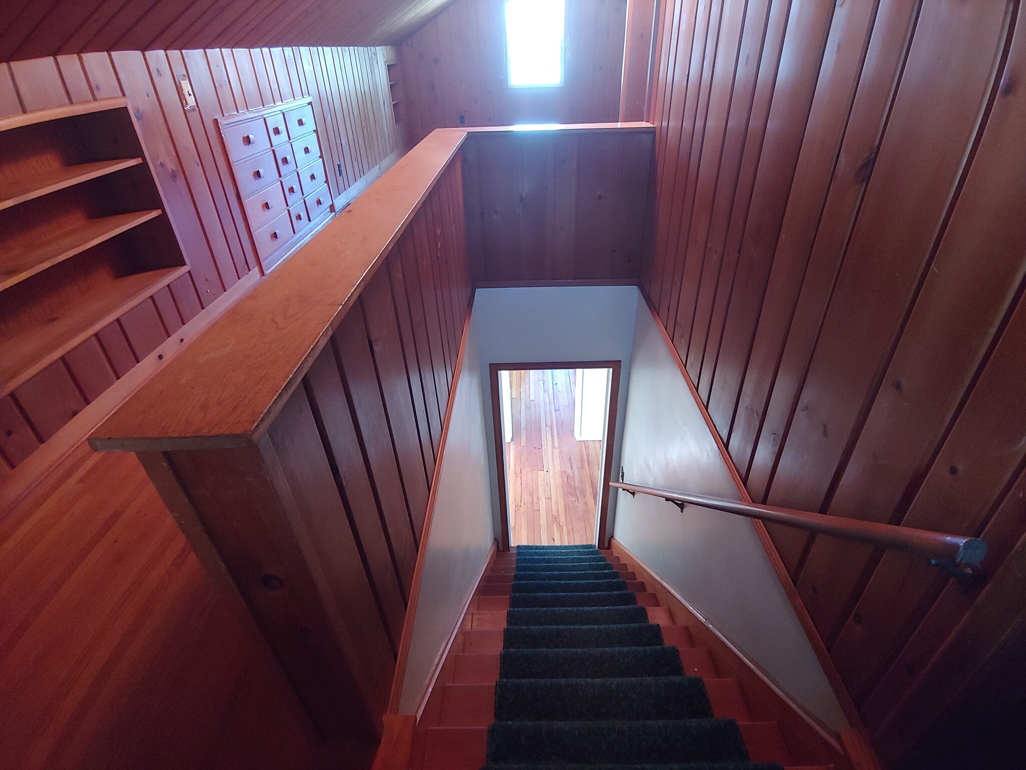 Third bedroom (upstairs), with natural cedar wood walls. - 7415 1st Ave S