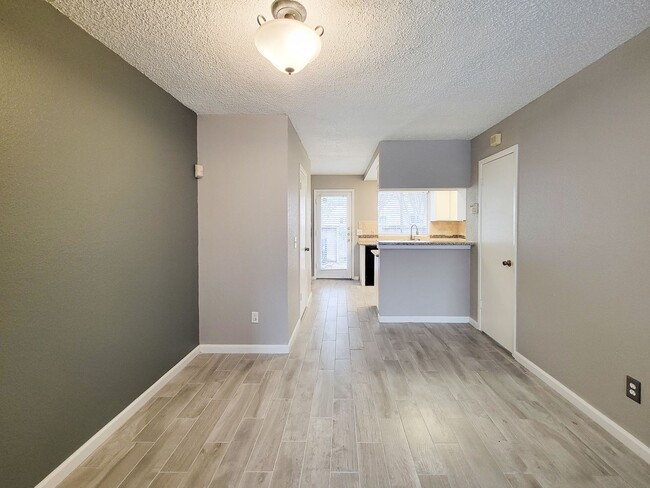 Building Photo - Welcome to This Charming Townhome Nestled ...