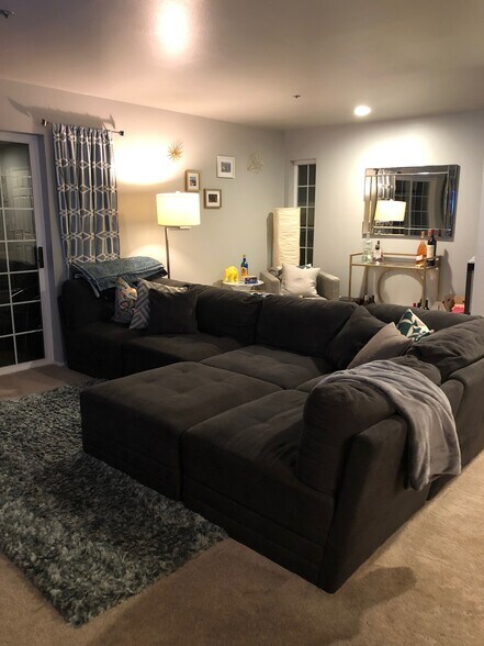 living room with big windows for natural light and bonus nook in back for office or bar area. - 9915 NE 124th St