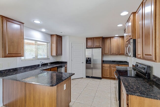 Building Photo - Spacious & Stylish 4/2 – Just  2 Miles fro...