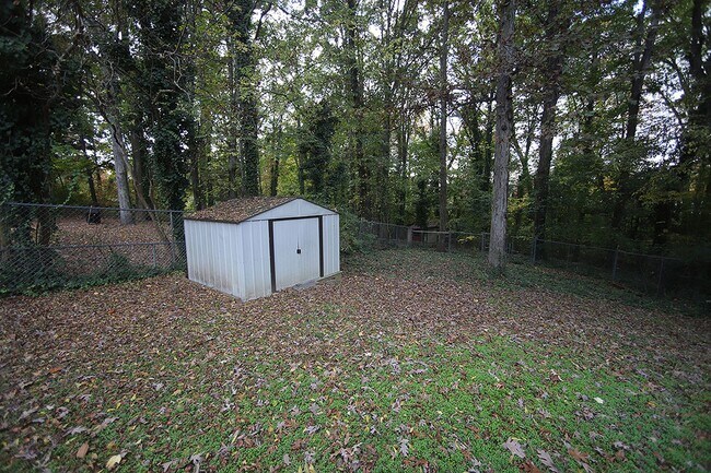 Building Photo - Charming and Cozy 3-Bedroom Racnh Home in Prime Raleigh Location with FENCED BACKYARD!!