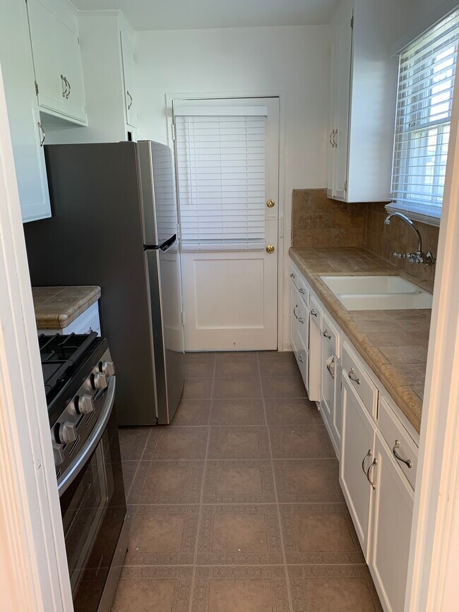 New tile kitchen countertop and grout - 3121 Arizona Ave