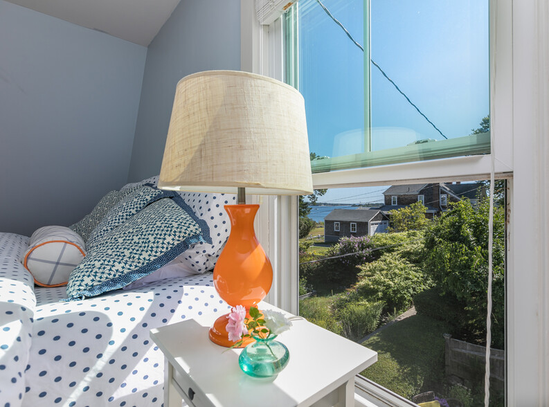 The OCEAN VIEW KING Guest Room with a flatscreen and views from both windows. - 23 Graffam Rd