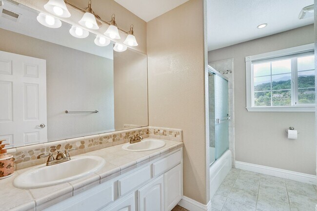 Building Photo - Remodeled 5 Bedroom Home with Heated Pool, Hillside Views, Solar, and Sunrise and Sunset Views in...
