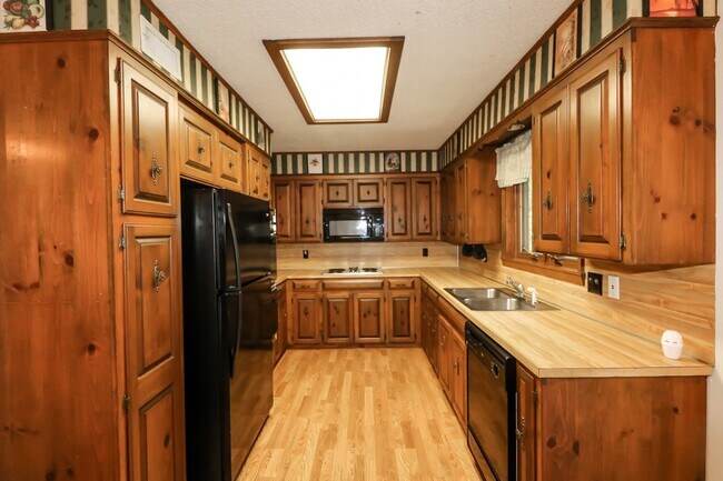 Building Photo - Two Bedroom, 2 Bath, 1-Car Garage, 1179 sq ft feet home with wood burning fireplace. and screened...