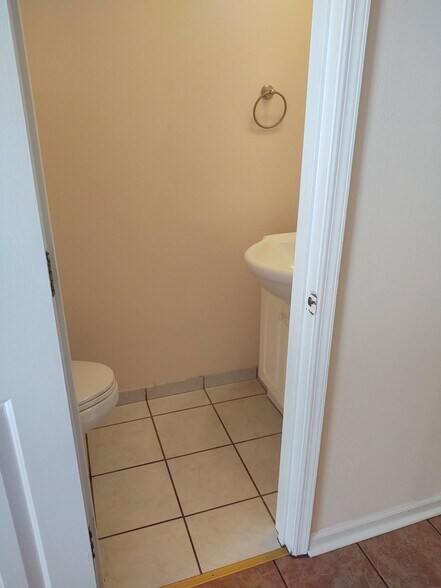 1st floor powder room tile floor - 251 Knight Dr