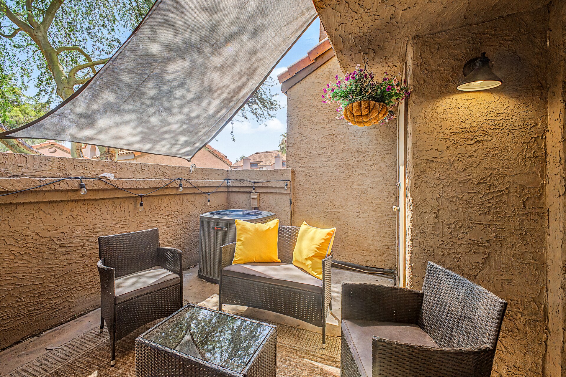 Outdoor seating area provides the ideal spot for soaking up the sun or enjoying an evening with cafe - 819 N College Ave
