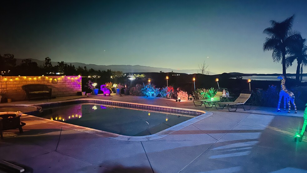 the beautiful pool view at night - 15691 Wendell Park Dr